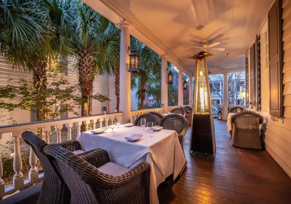 A set restaurant table arranged for an evening reservation